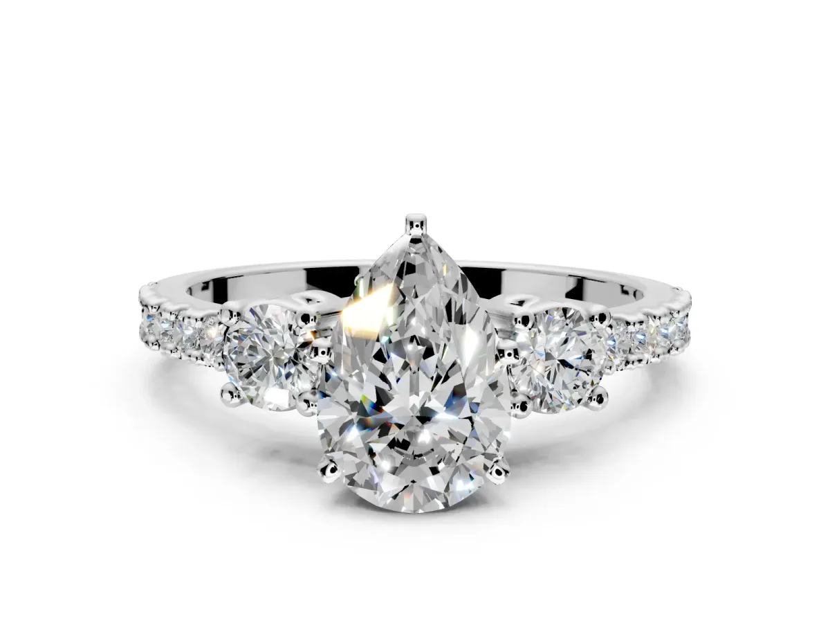 3 Stone Engagement Ring Setting for Pear-Shaped Center with Round Cut Side Accents and Prong Head in Platinum