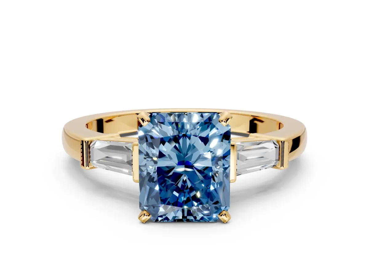 3 Stone Engagement Ring Setting for Fancy Blue Radiant Cut Center with Channel Baguette Accents and Prong Head in Yellow Gold