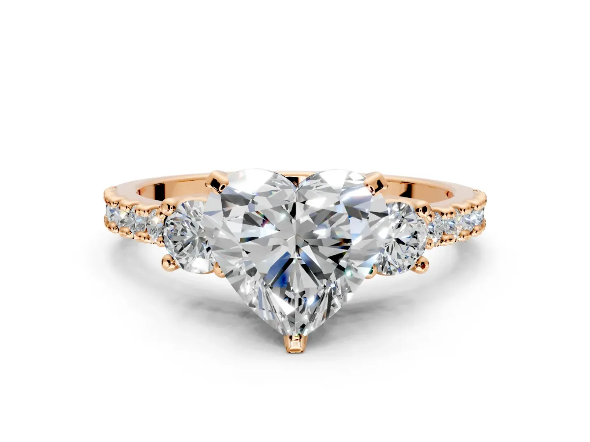 3 Stone Engagement Ring Setting for Heart-Shaped Center with Round Cut Side Accents and Prong Head in Rose Gold