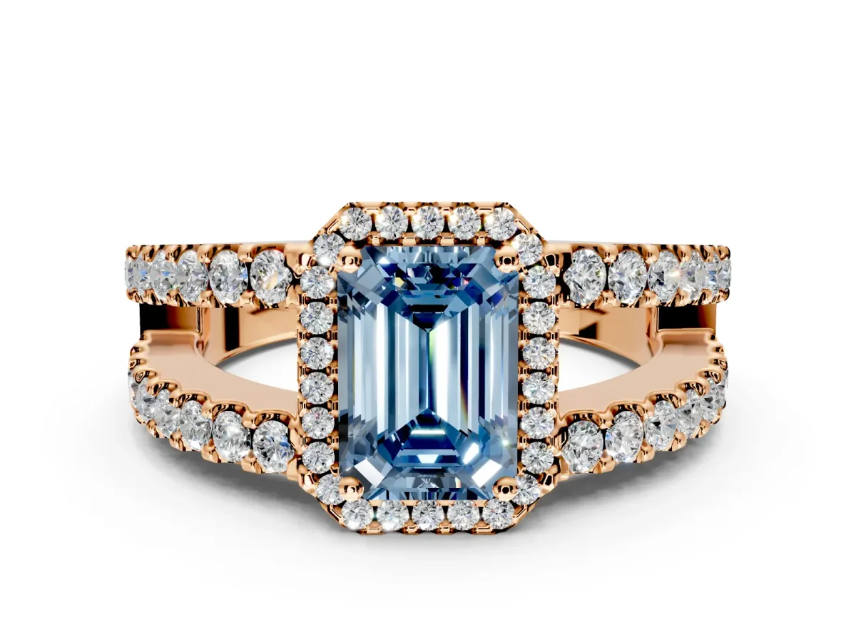 Halo Engagement Ring Setting for Fancy Blue Emerald Cut Center with Wide-Open Pave Split Shank and Prong Head in Rose Gold