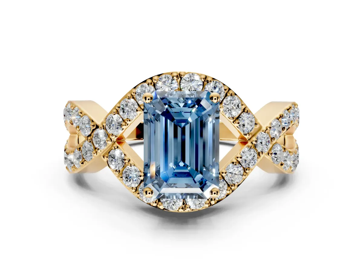 Halo Engagement Ring Setting for Fancy Blue Emerald Cut Center with Pave Infinity Twist Band and Prong Head in Yellow Gold
