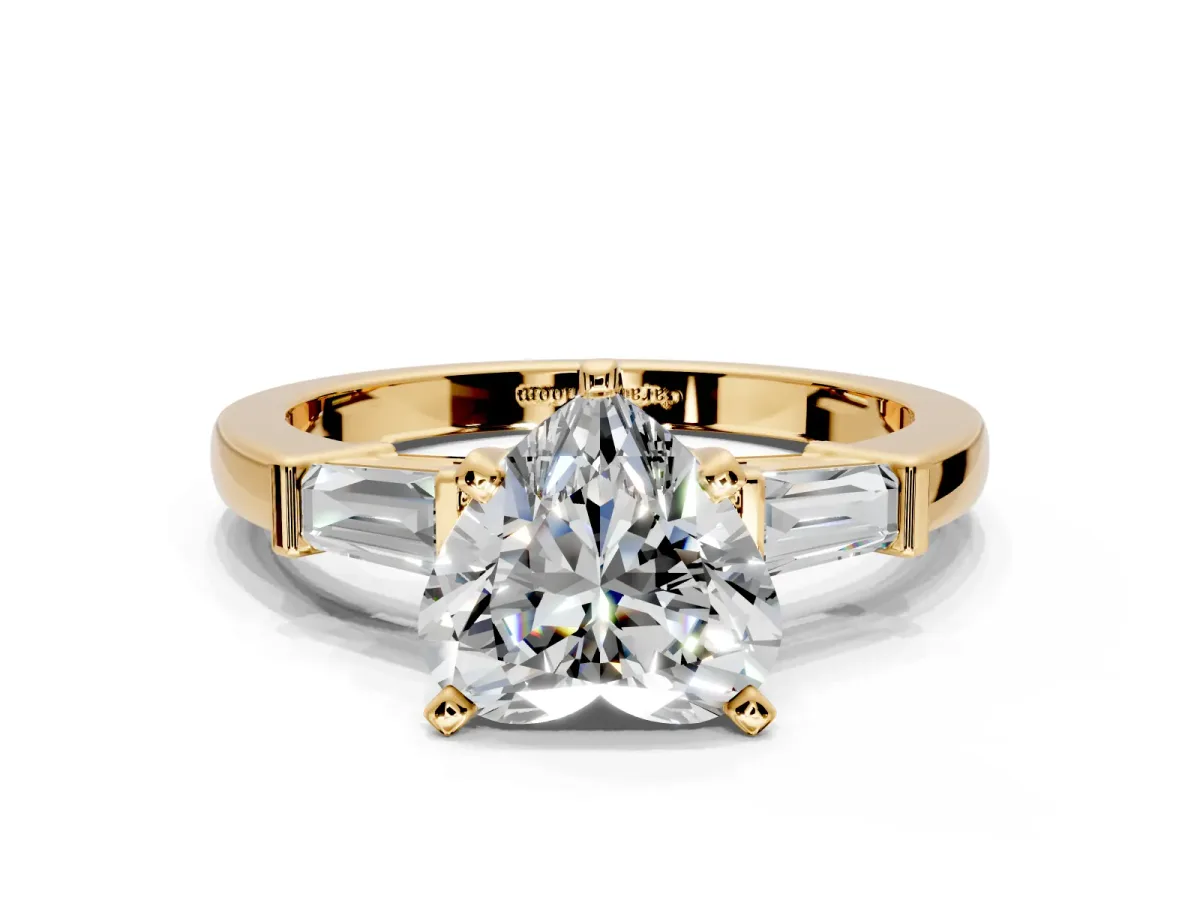 3 Stone Engagement Ring Setting for Heart-Shaped Center with Channel Baguette Accents and Prong Head in Yellow Gold