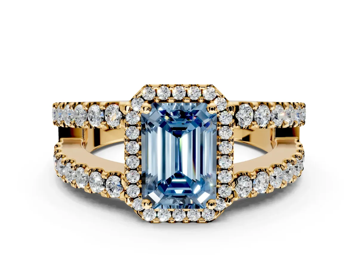 Halo Engagement Ring Setting for Fancy Blue Emerald Cut Center with Wide-Open Pave Split Shank and Prong Head in Yellow Gold