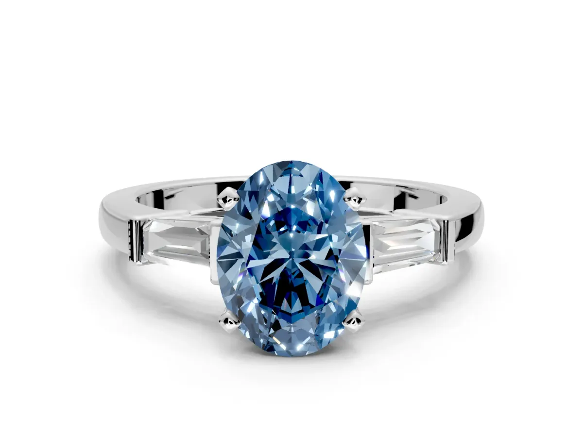 3 Stone Engagement Ring Setting for Fancy Blue Oval Center with Channel Baguette Accents and Prong Head in White Gold