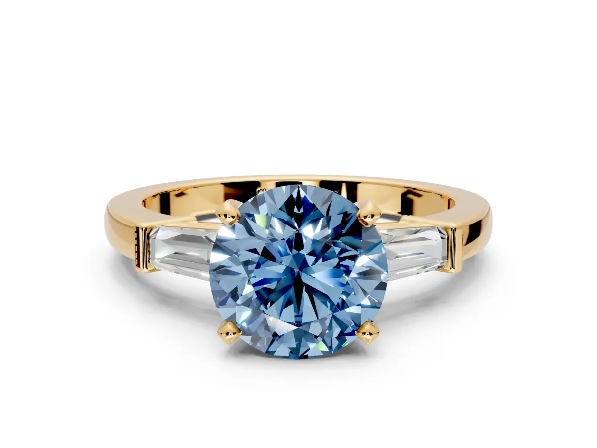 3 Stone Engagement Ring Setting for Fancy Blue Round Cut Center with Channel Baguette Accents and Prong Head in Yellow Gold