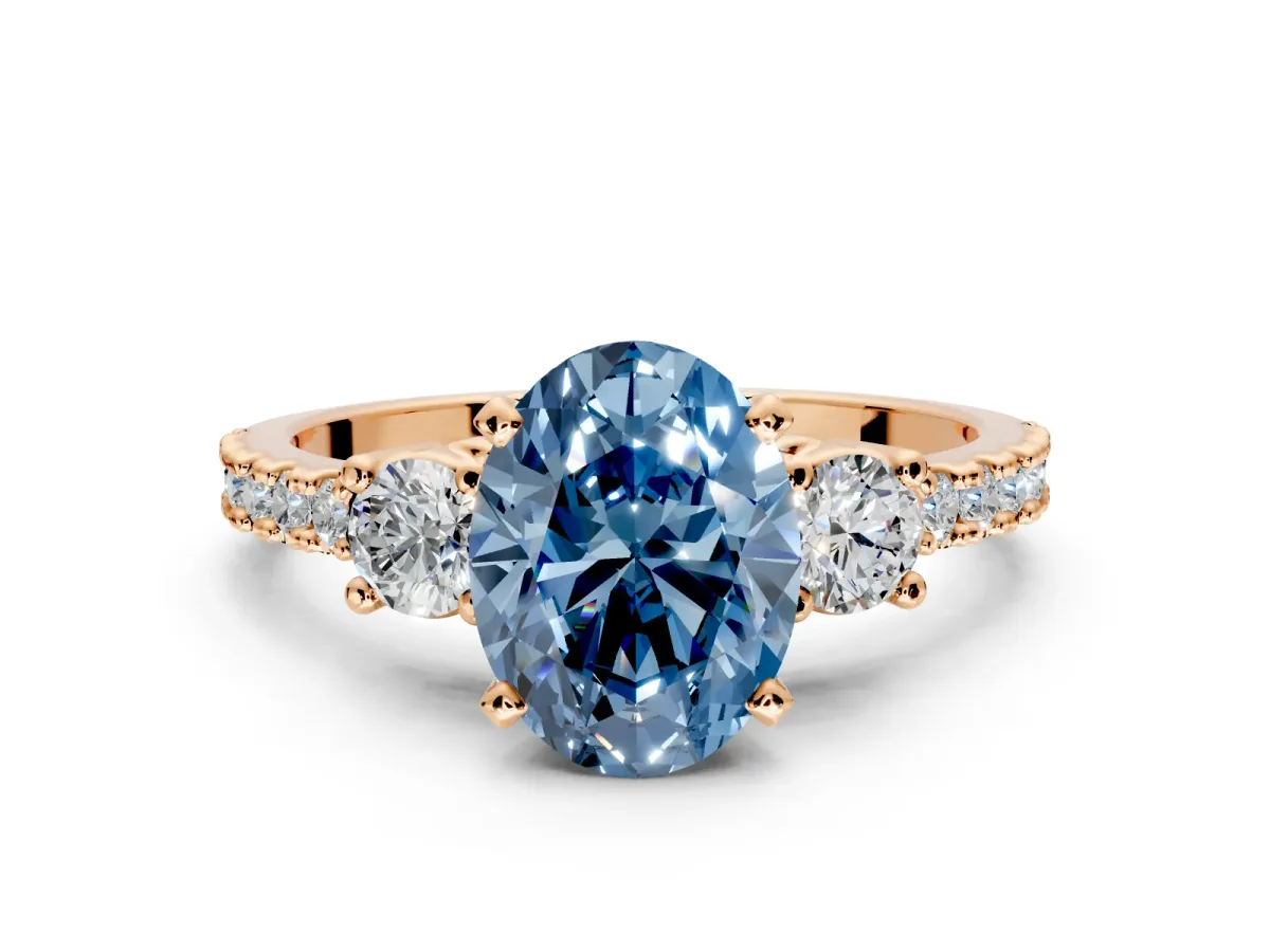 3 Stone Engagement Ring Setting for Fancy Blue Oval Center with Round Cut Side Accents and Prong Head in Rose Gold