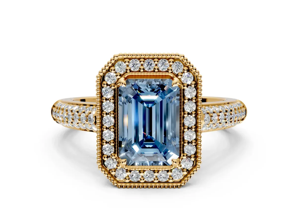 Milgrain Halo Engagement Ring Setting for Fancy Blue Emerald Cut Center with Three-Sided Pave Band and Prong Head in Yellow Gold