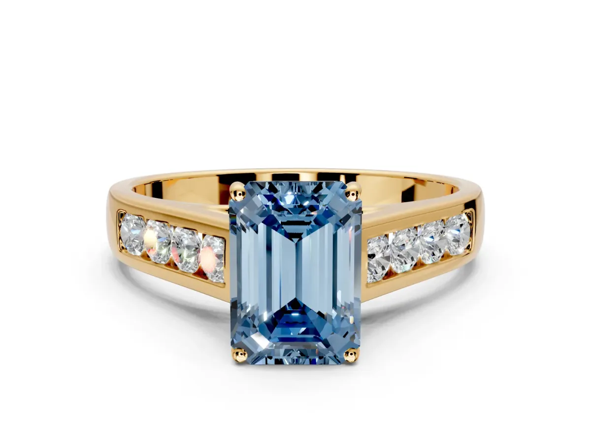 Solitaire Engagement Ring Setting for Fancy Blue Emerald Cut Center with Cathedral Channel Band and Prong Head in Yellow Gold