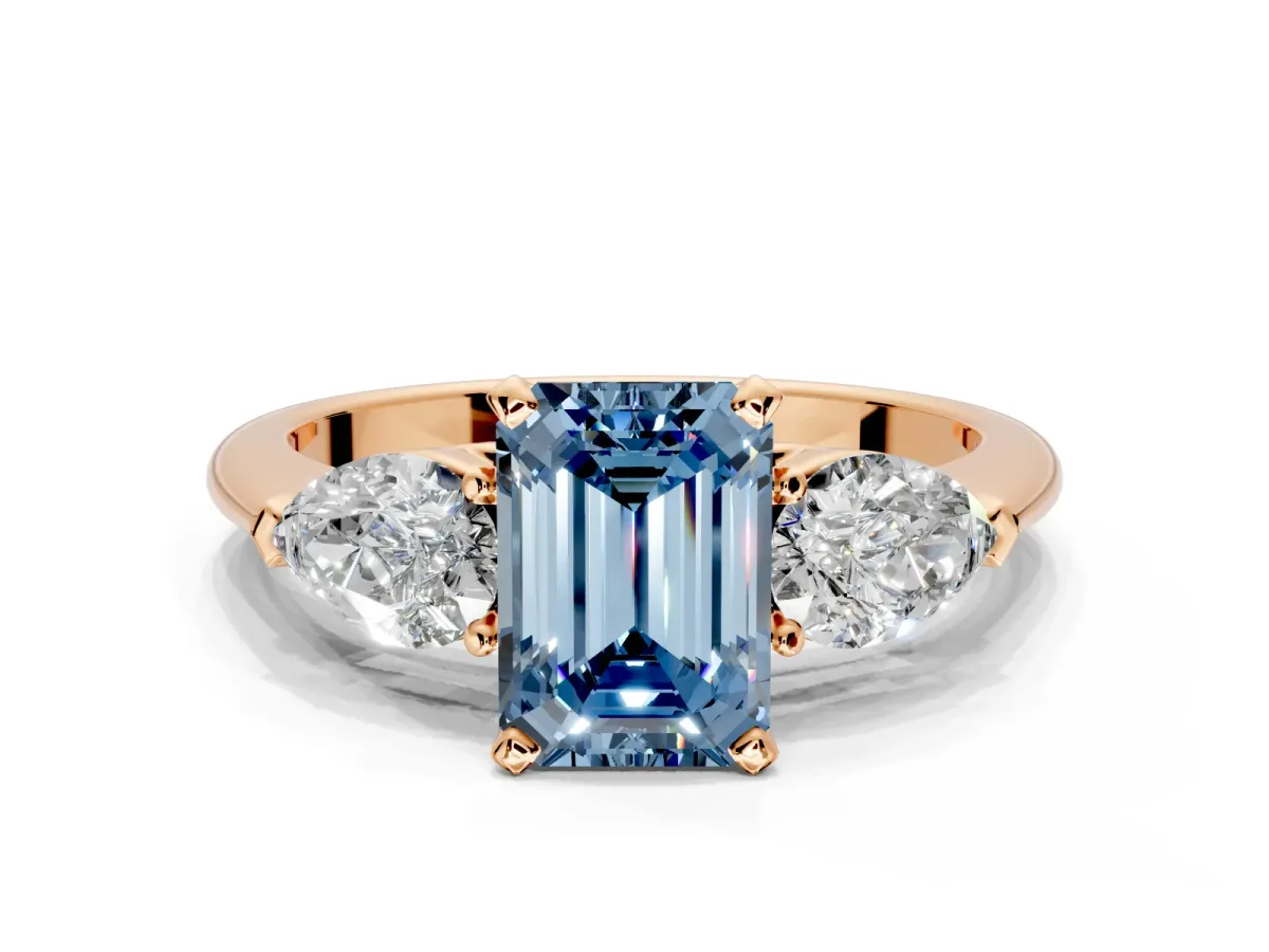 3 Stone Engagement Ring Setting for Fancy Blue Emerald Cut Center with Large Pear-Shaped Accents and Prong Head in Rose Gold
