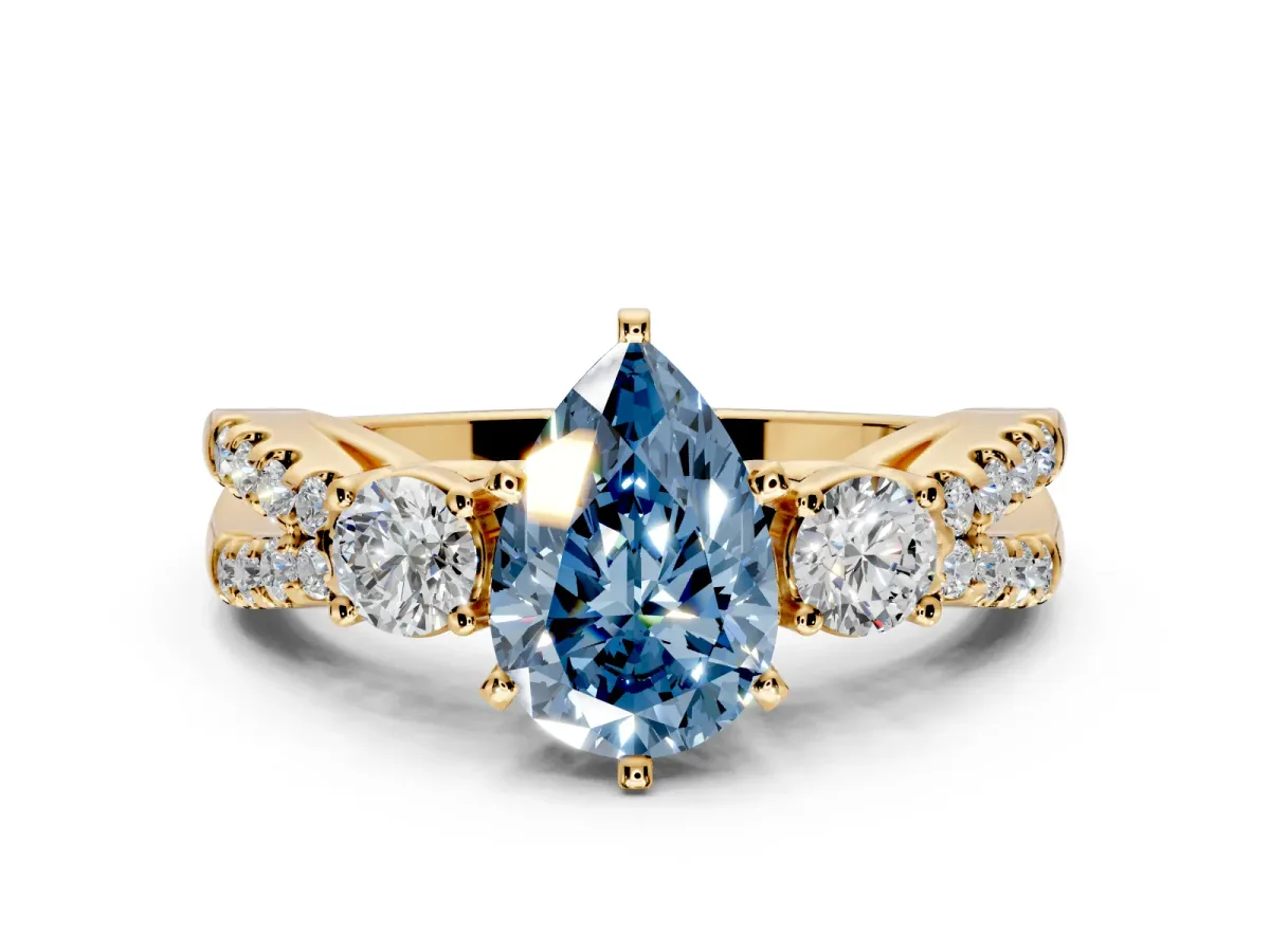 3 Stone Engagement Ring Setting for Fancy Blue Pear-Shaped Center with Pave Split Shank and Prong Head in Yellow Gold