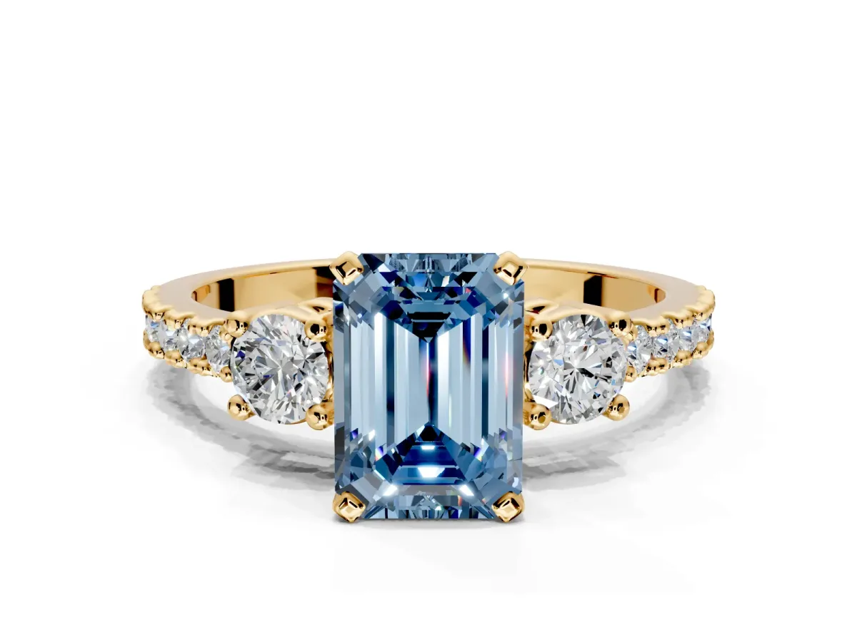 3 Stone Engagement Ring Setting for Fancy Blue Emerald Cut Center with Round Cut Side Accents and Prong Head in Yellow Gold