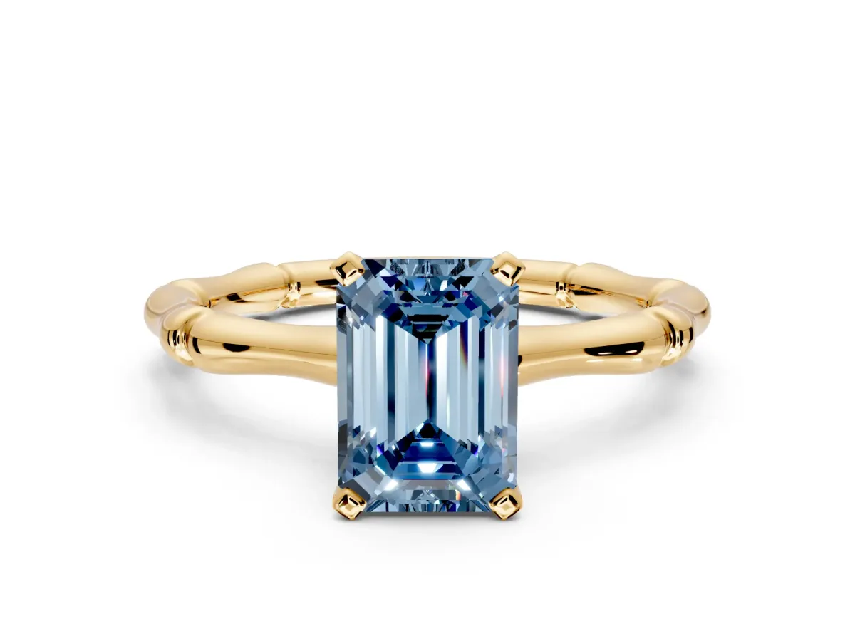 Solitaire Engagement Ring Setting for Fancy Blue Emerald Cut Center with Bamboo Band and Prong Head in Yellow Gold