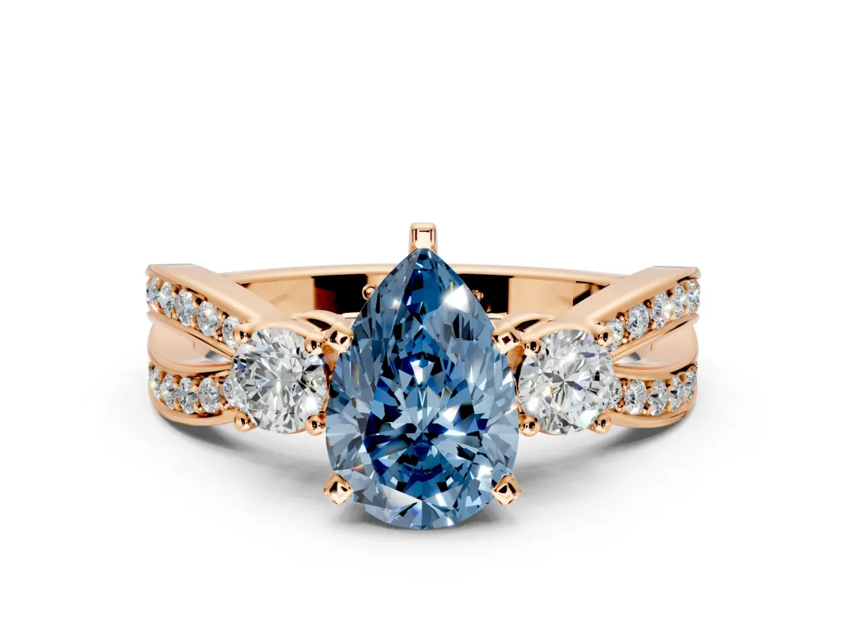 3 Stone Engagement Ring Setting for Fancy Blue Pear-Shaped Center with Pave Twist Band and Prong Head in Rose Gold