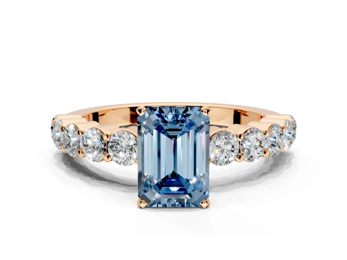 Shared-Prong Engagement Ring Setting for Fancy Blue Emerald Cut Center with Graduated Accents and Prong Head in Rose Gold