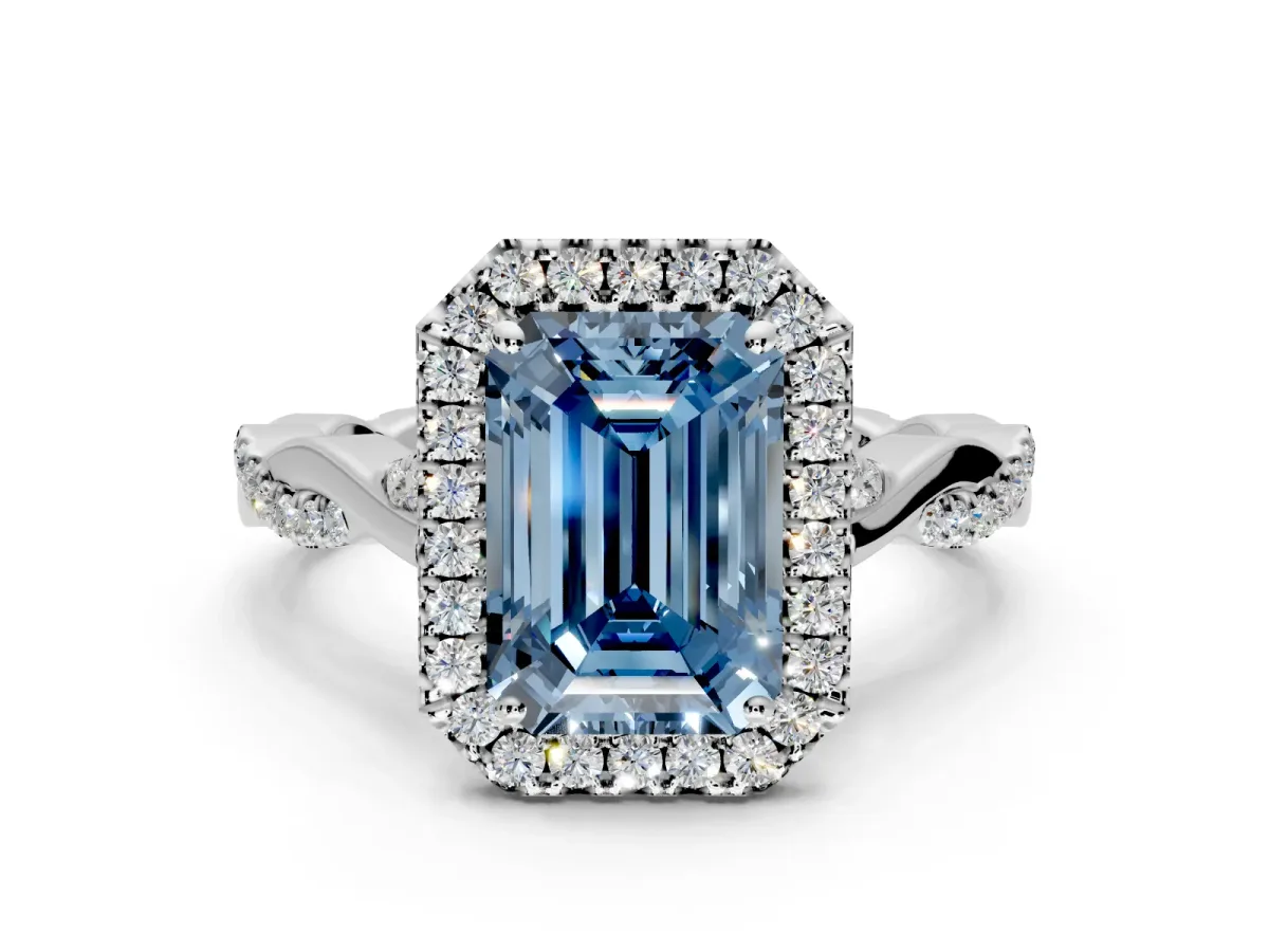 Halo Engagement Ring Setting for Fancy Blue Emerald Cut Center with Twist Band and Prong Head in Platinum