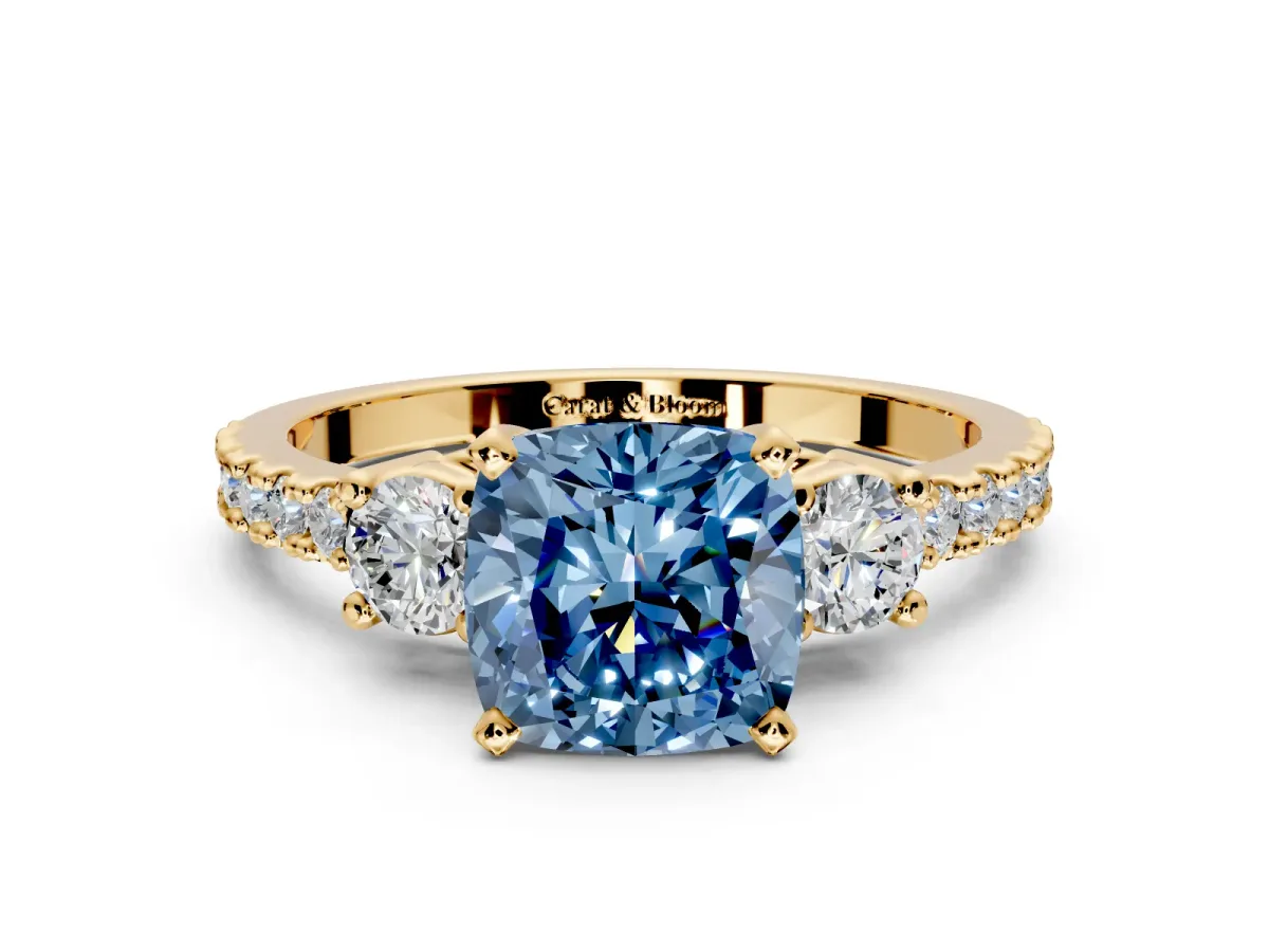 3 Stone Engagement Ring Setting for Fancy Blue Cushion Cut Center with Round Cut Side Accents and Prong Head in Yellow Gold