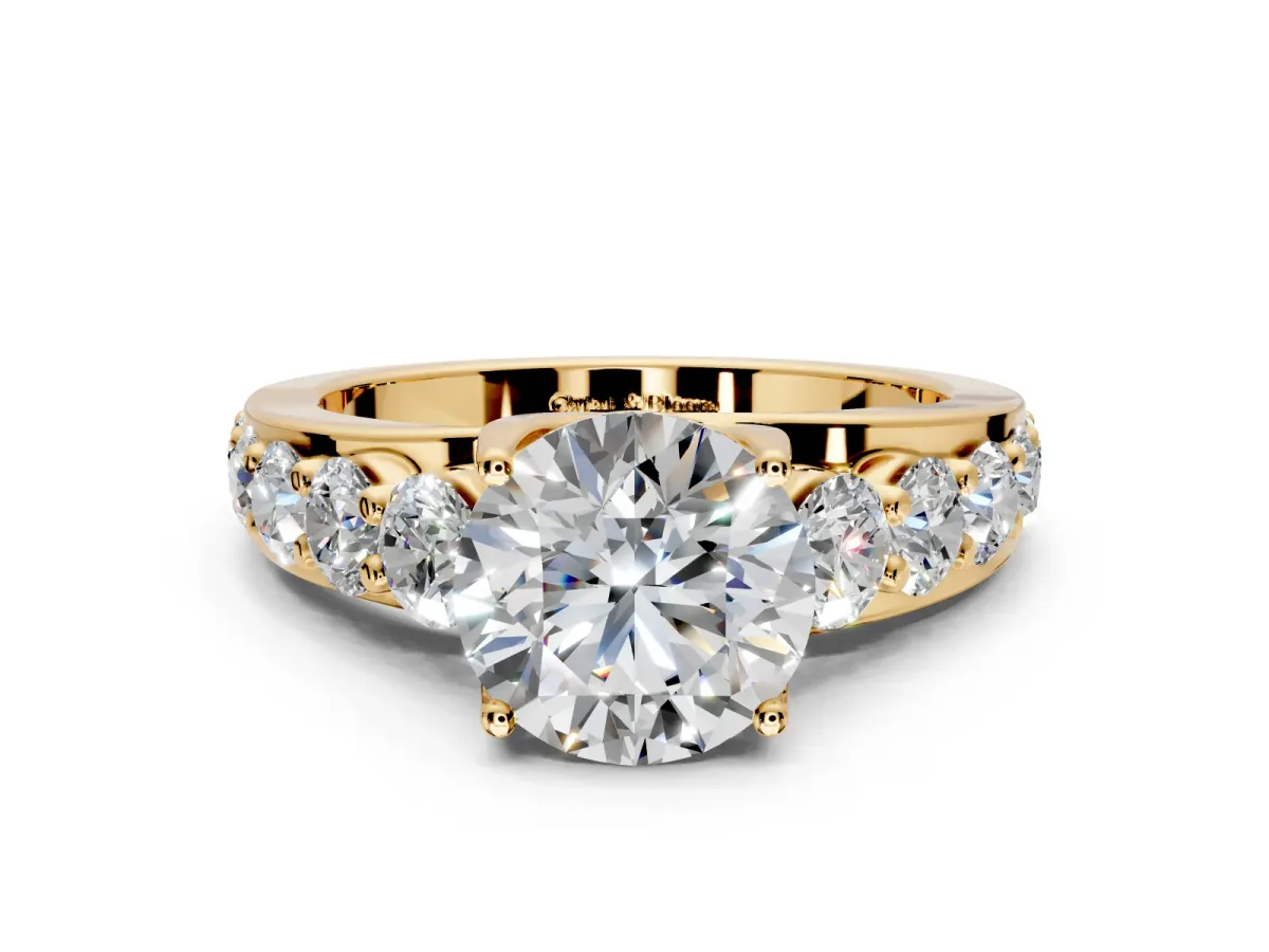 Solitaire Engagement Ring Setting for Round Cut Center with Graduated Shared Prongs and Prong Head in Yellow Gold