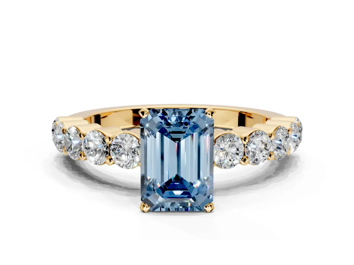 Shared-Prong Engagement Ring Setting for Fancy Blue Emerald Cut Center with Graduated Accents and Prong Head in Yellow Gold