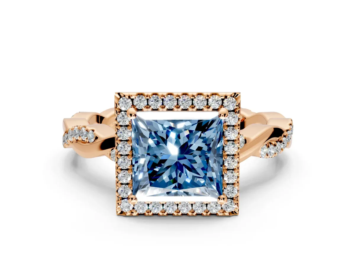 Halo Engagement Ring Setting for Fancy Blue Princess Cut Center with Pave and Plain Twist Band and Prong Head in Rose Gold