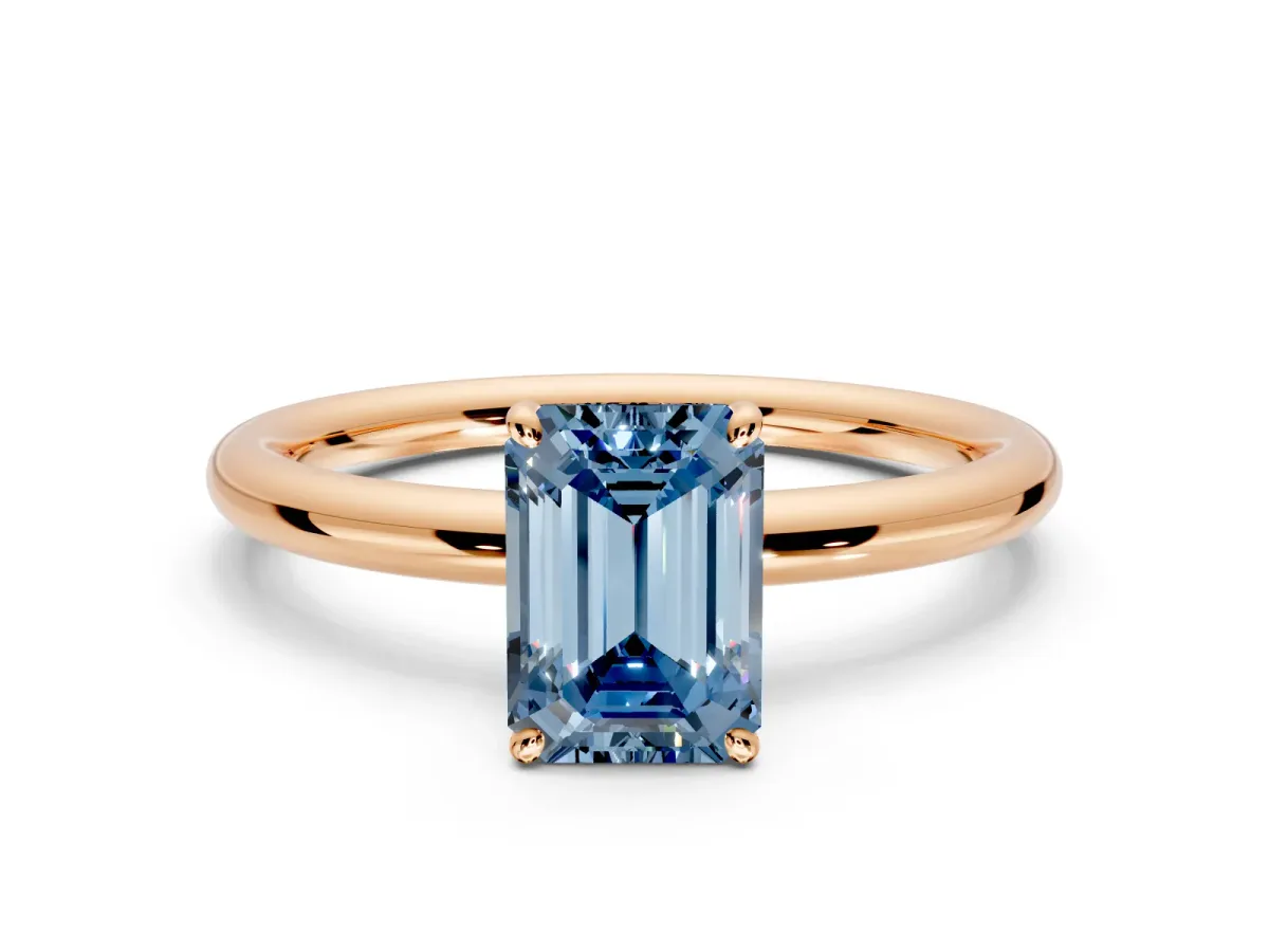 Low-Set Solitaire Engagement Ring Setting for Fancy Blue Emerald Cut Center with Thin Plain Band and Prong Head in Rose Gold