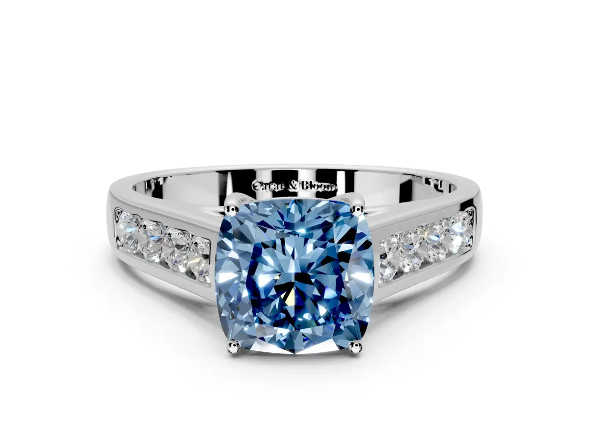 Solitaire Engagement Ring Setting for Fancy Blue Cushion Cut Center with Round Cut Channel Band and Prong Head in White Gold
