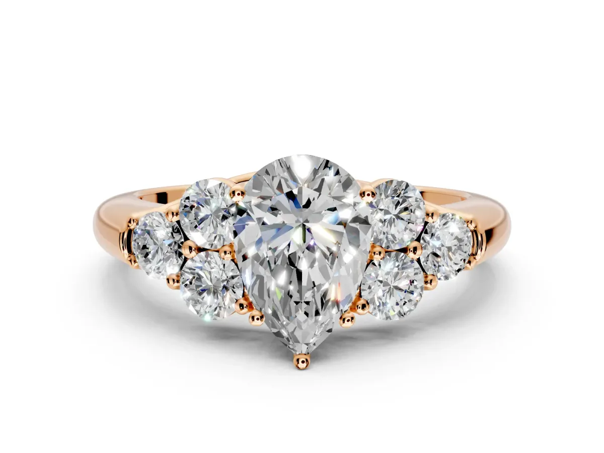 Cluster Engagement Ring Setting for Pear-Shaped Center with Round Cut Accent Frame and Prong Head in Rose Gold