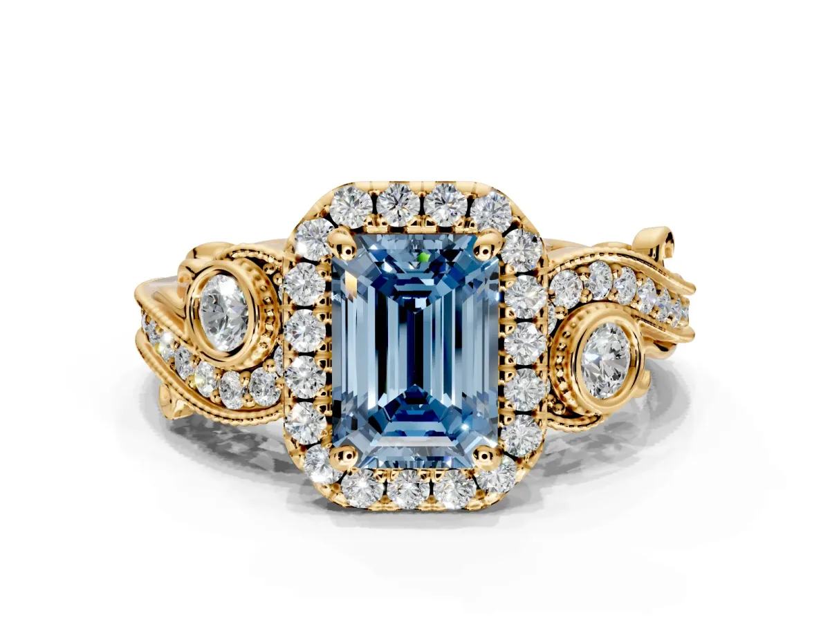 Milgrain Halo Engagement Ring Setting for Fancy Blue Emerald Cut Center with Shoulder Bezels and Prong Head in Yellow Gold