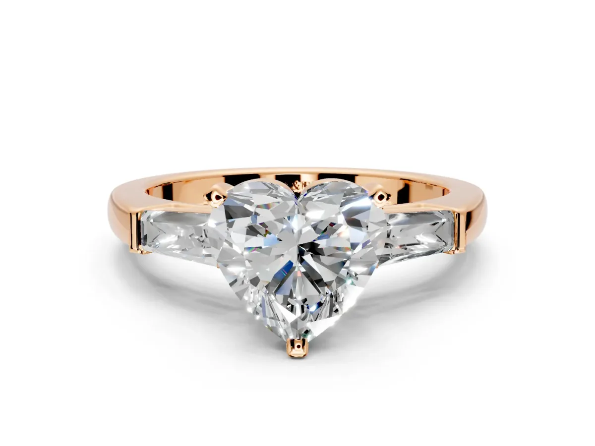 3 Stone Engagement Ring Setting for Heart-Shaped Center with Tapered Baguettes, Plain Band and Prong Head in Rose Gold