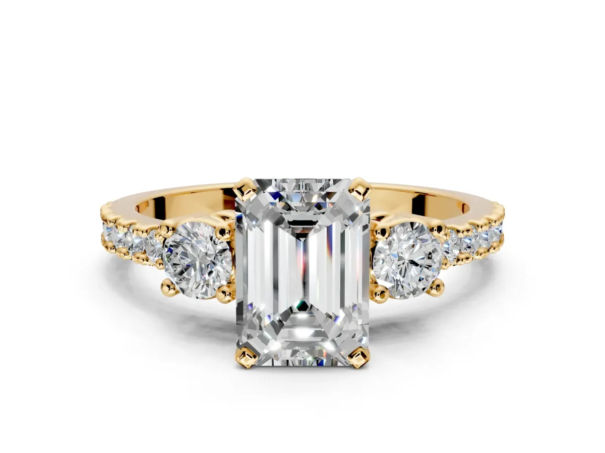 3 Stone Engagement Ring Setting for Emerald Cut Center with Round Cut Side Accents and Prong Head in Yellow Gold