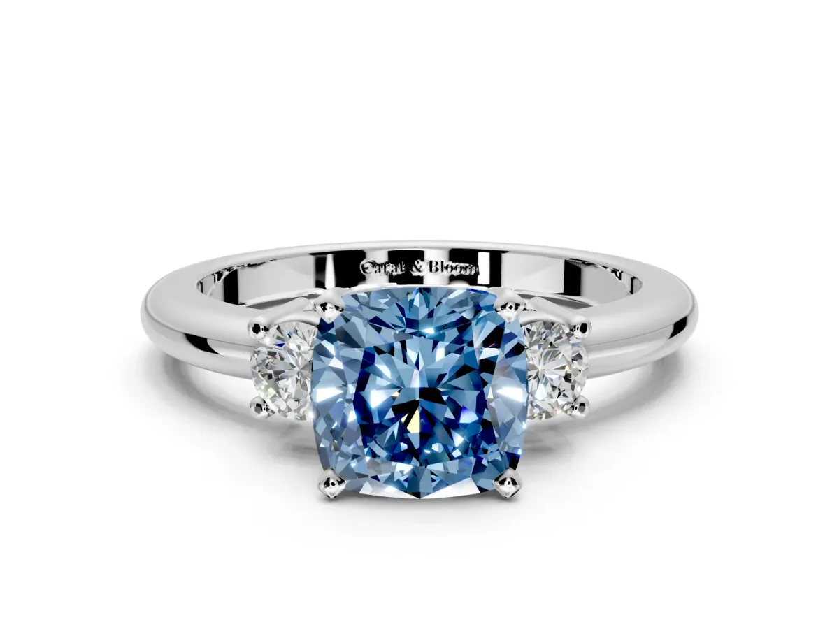 3 Stone Engagement Ring Setting for Fancy Blue Cushion Cut Center with Wide Plain Band and Prong Head in Platinum