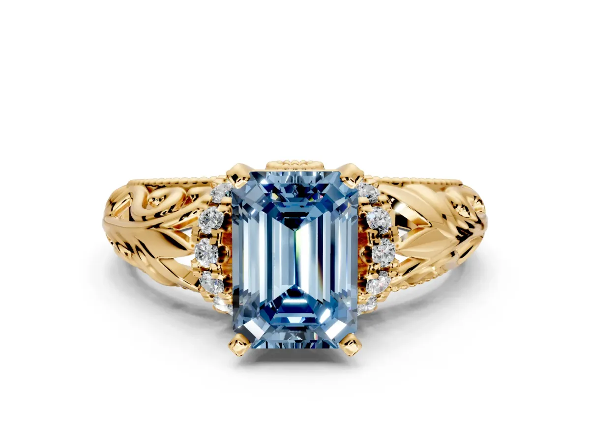 Solitaire Engagement Ring Setting for Fancy Blue Emerald Cut Center with Filigree Accent Basket and Prong Head in Yellow Gold