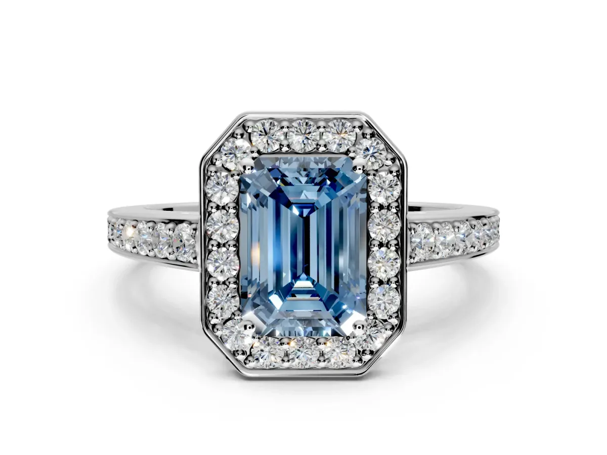 Bezel-Framed Halo Engagement Ring Setting for Fancy Blue Emerald Cut Center with Pave Band and Prong Head in Platinum