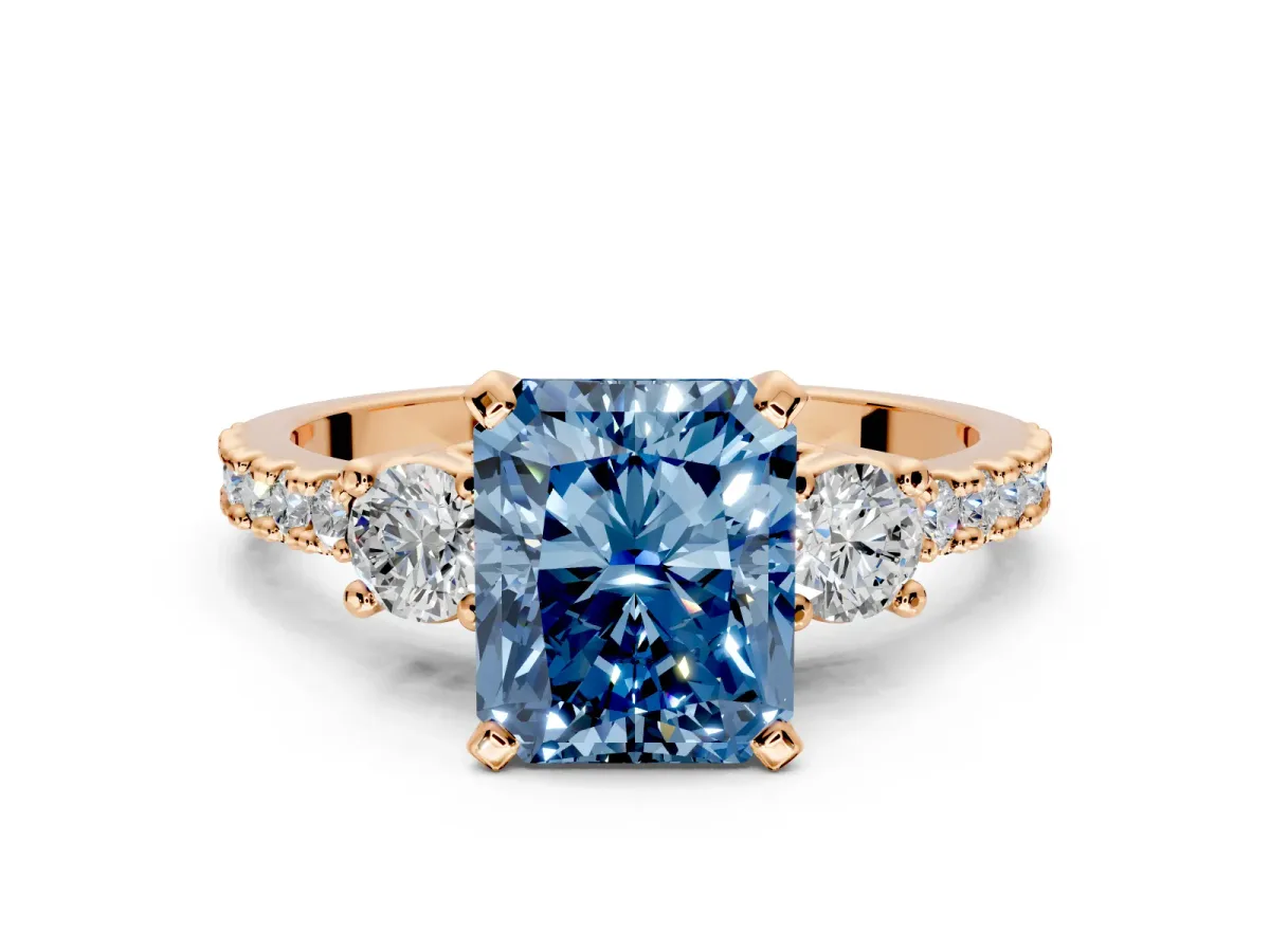 3 Stone Engagement Ring Setting for Fancy Blue Radiant Cut Center with Round Cut Side Accents and Prong Head in Rose Gold