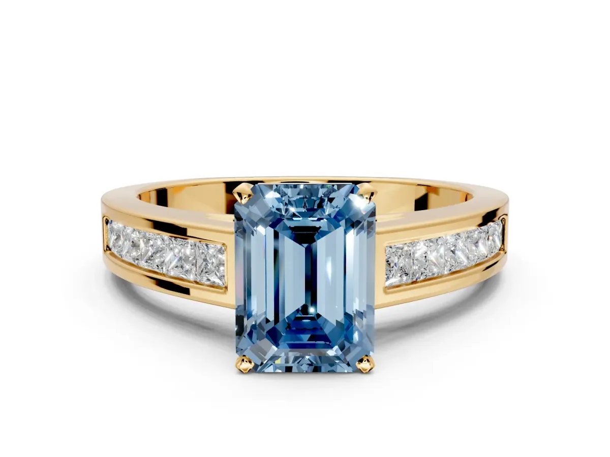 Solitaire Engagement Ring Setting for Fancy Blue Emerald Cut Center with Princess Cut Channel Band and Prong Head in Yellow Gold