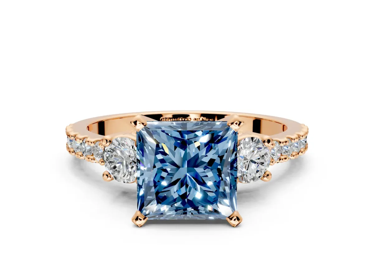 3 Stone Engagement Ring Setting for Fancy Blue Princess Cut Center with Round Cut Side Accents and Prong Head in Rose Gold