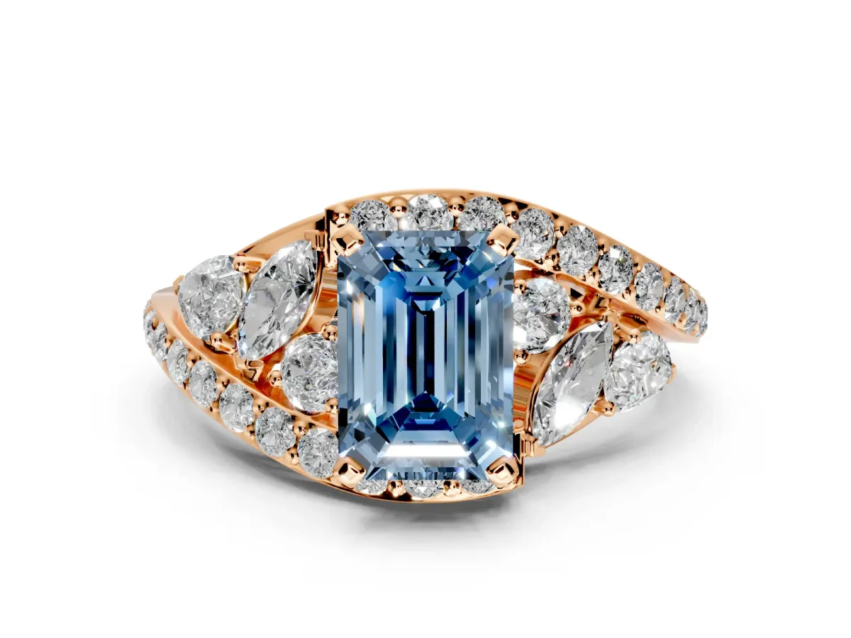 Halo Engagement Ring Setting for Fancy Blue Emerald Cut Center with Marquise and Pave Bypass Band and Prong Head in Rose Gold