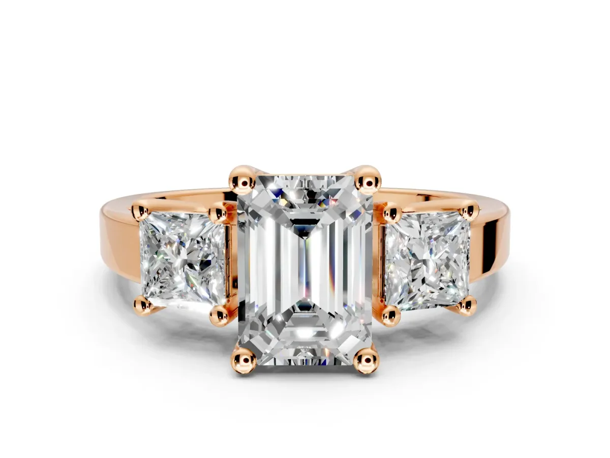 3 Stone Engagement Ring Setting for Emerald Cut Center with Matching Side Accents and Prong Head in Rose Gold