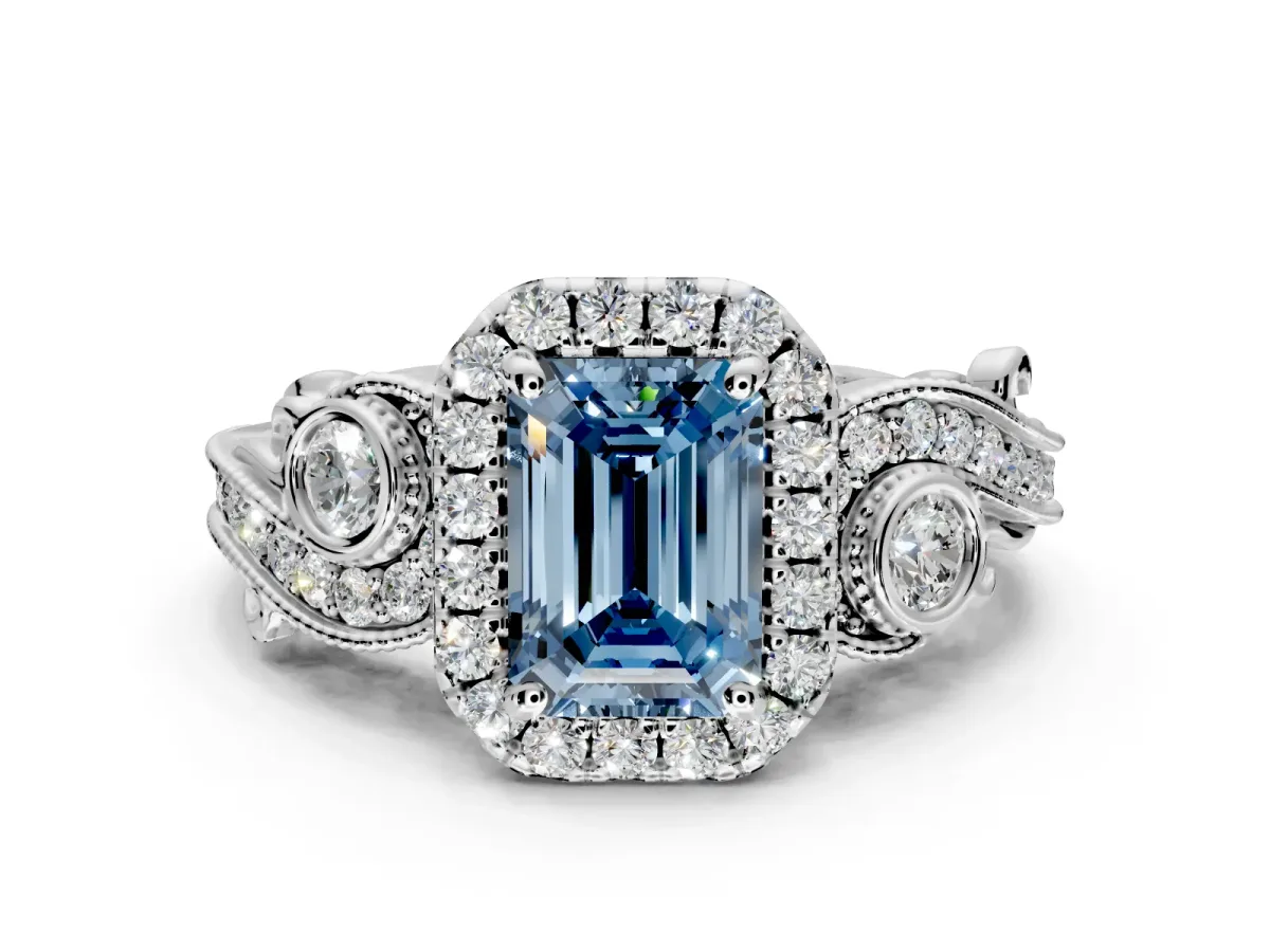 Milgrain Halo Engagement Ring Setting for Fancy Blue Emerald Cut Center with Shoulder Bezels and Prong Head in Platinum