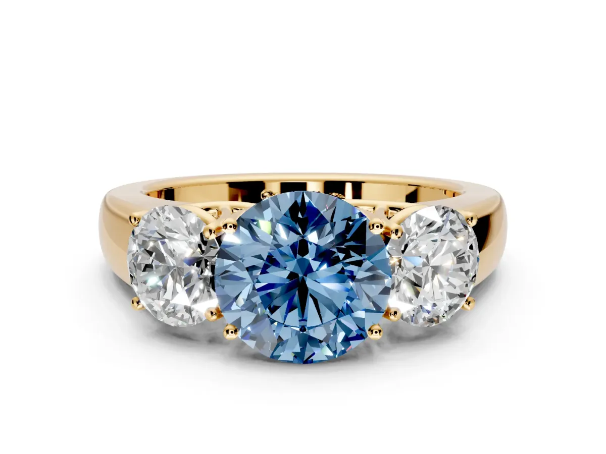 3 Stone Engagement Ring Setting for Fancy Blue Round Cut Center with Raised Basket Heads and Prong Head in Yellow Gold
