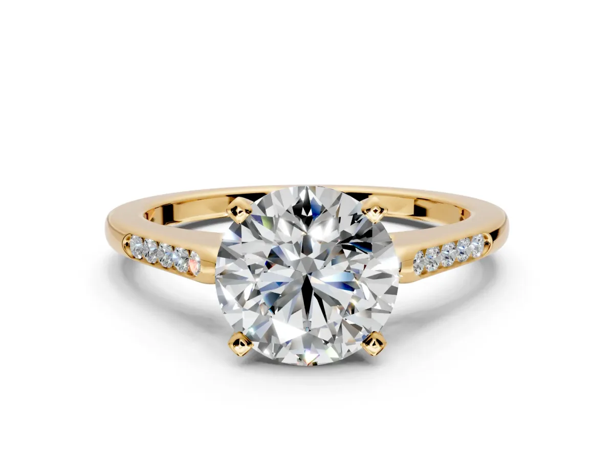 Solitaire Engagement Ring Setting for Round Cut Center with Channel Accents and Prong Head in Yellow Gold