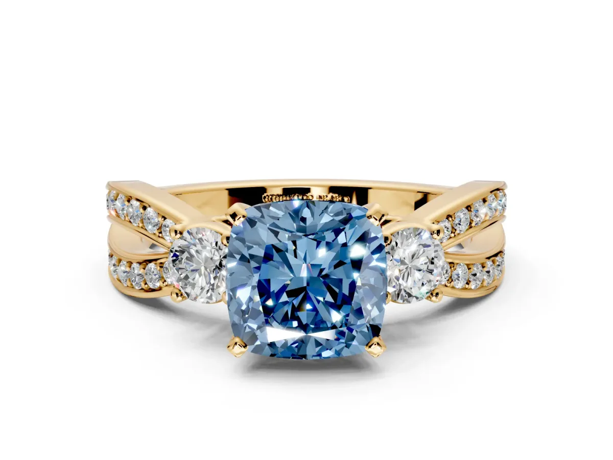 3 Stone Engagement Ring Setting for Fancy Blue Cushion Cut Center with Pave Twist Band and Prong Head in Yellow Gold