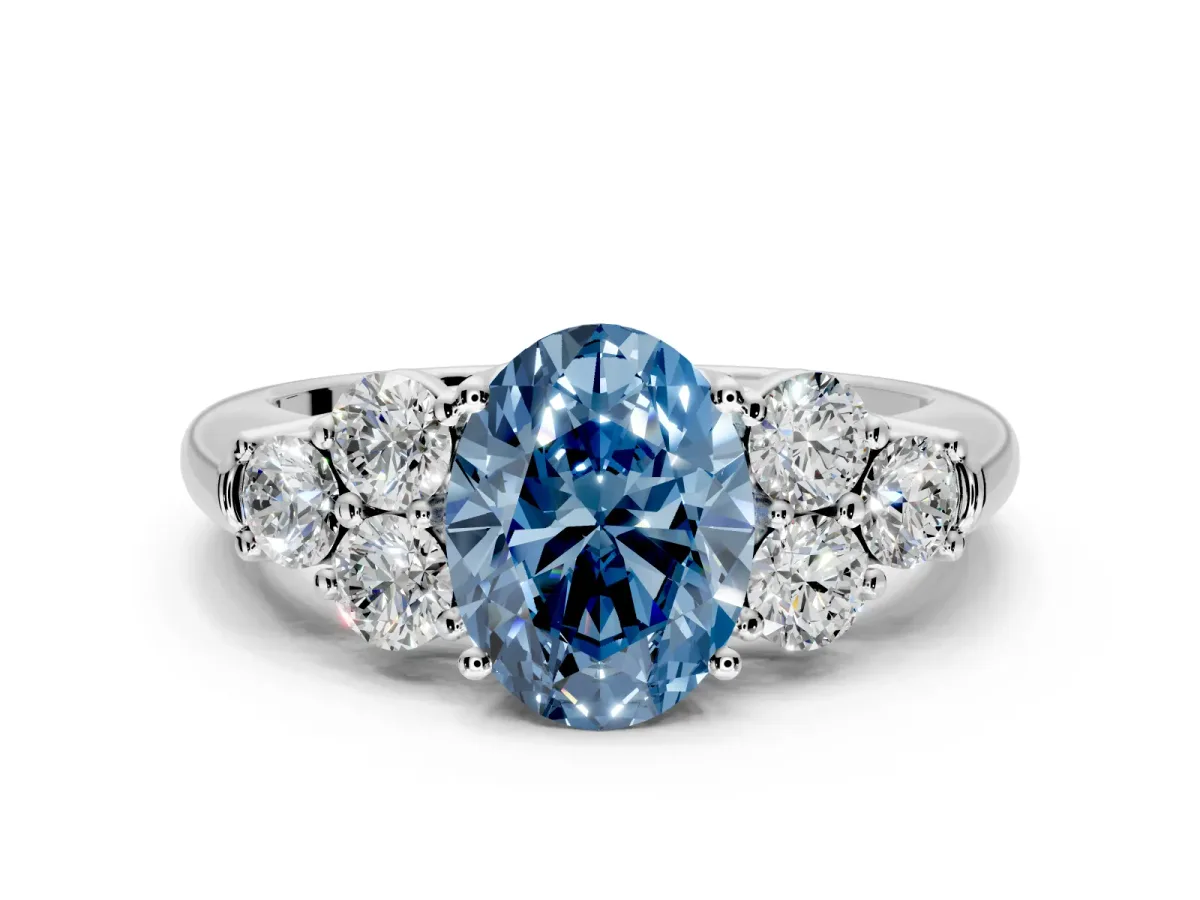Cluster Engagement Ring Setting for Fancy Blue Oval Center with Round Cut Accent Frame and Prong Head in White Gold