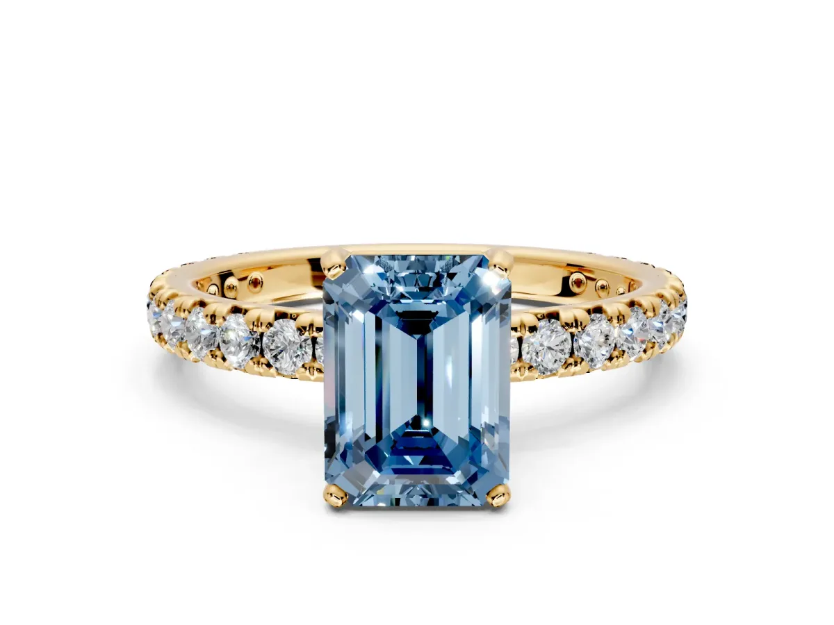Solitaire Engagement Ring Setting for Fancy Blue Emerald Cut Center with Shared-Prong Accents and Prong Head in Yellow Gold