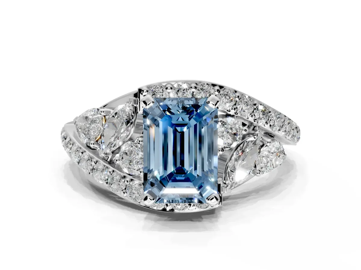 Halo Engagement Ring Setting for Fancy Blue Emerald Cut Center with Marquise and Pave Bypass Band and Prong Head in White Gold