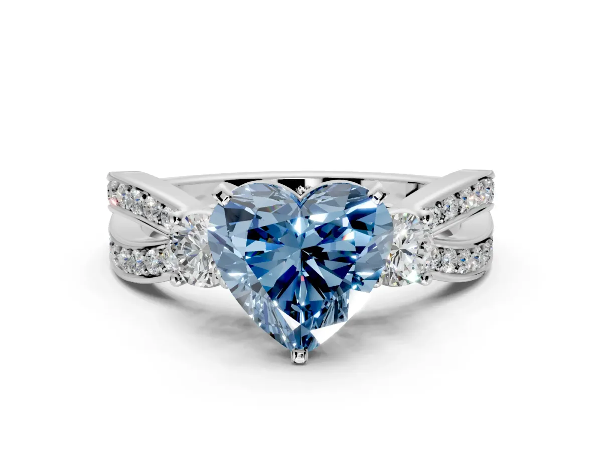 3 Stone Engagement Ring Setting for Fancy Blue Heart-Shaped Center with Pave Twist Band and Prong Head in Platinum