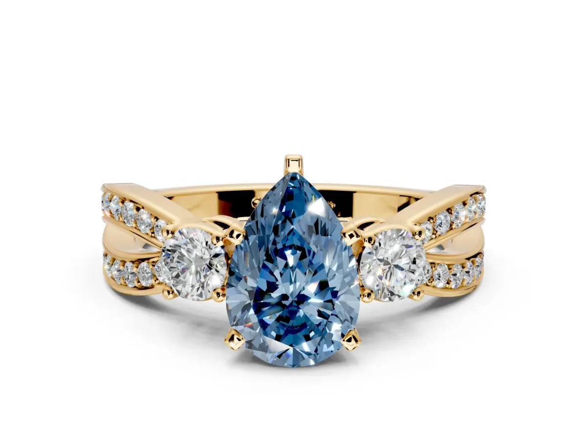 3 Stone Engagement Ring Setting for Fancy Blue Pear-Shaped Center with Pave Twist Band and Prong Head in Yellow Gold