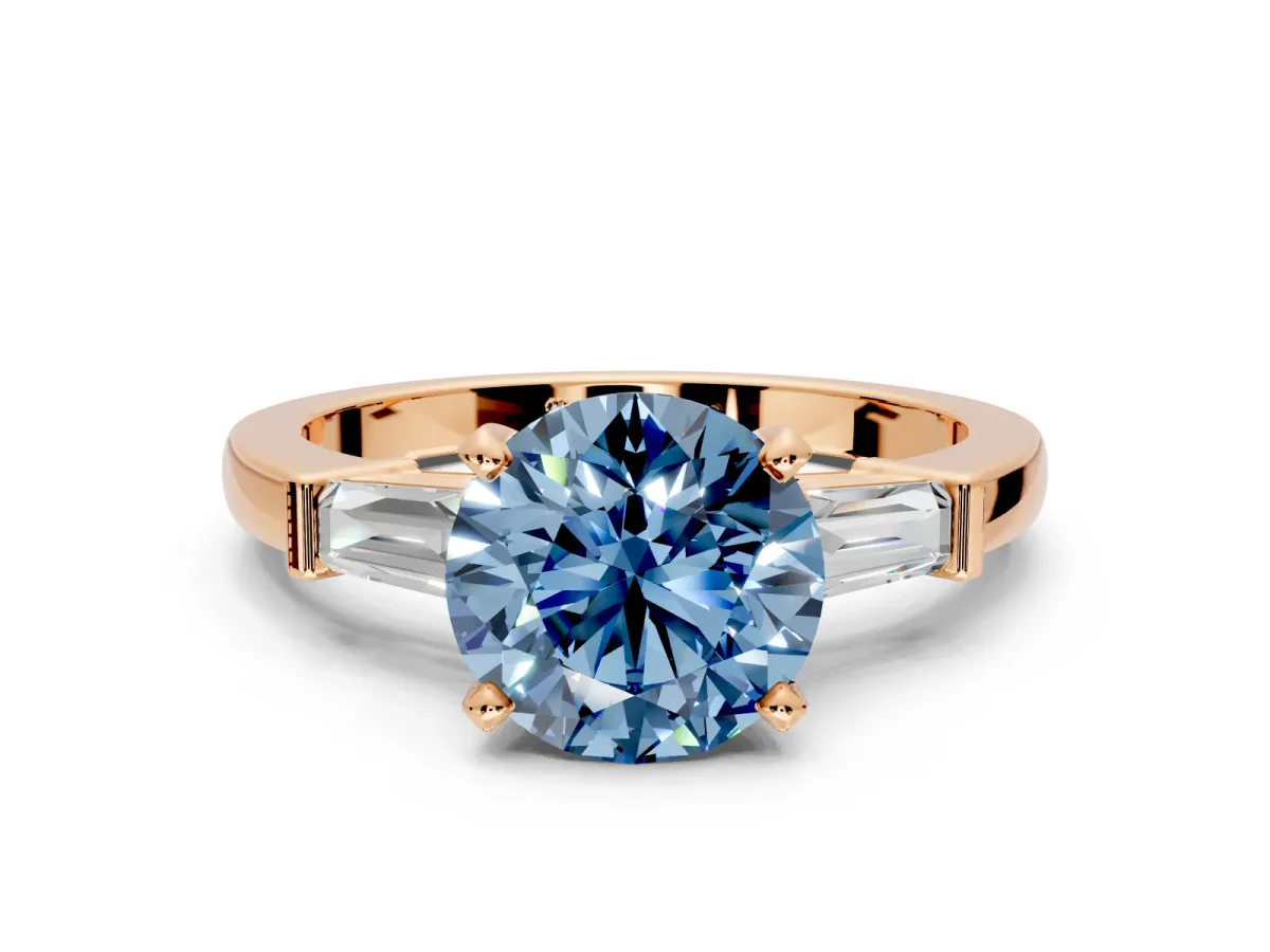 3 Stone Engagement Ring Setting for Fancy Blue Round Cut Center with Channel Baguette Accents and Prong Head in Rose Gold