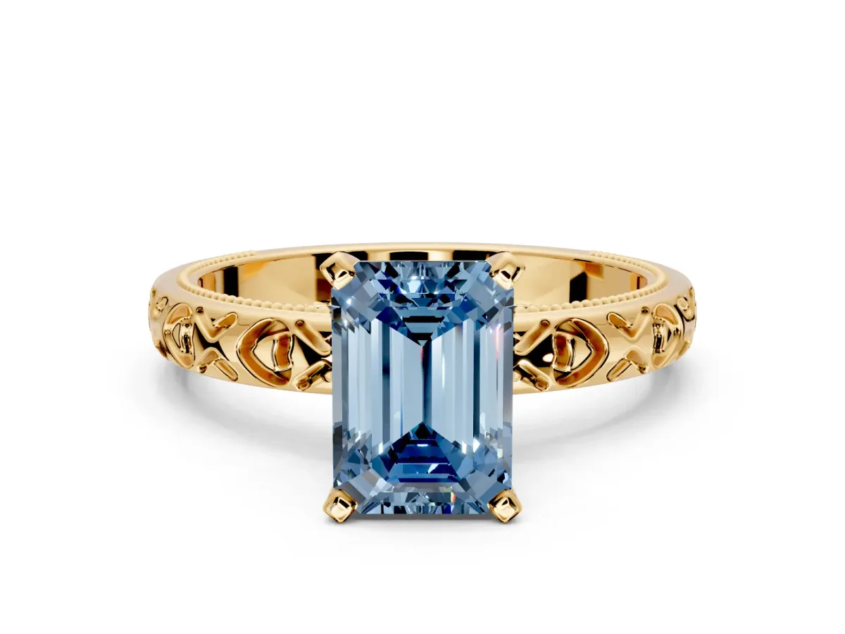 Solitaire Engagement Ring Setting for Fancy Blue Emerald Cut Center with XO Engraved Band and Prong Head in Yellow Gold