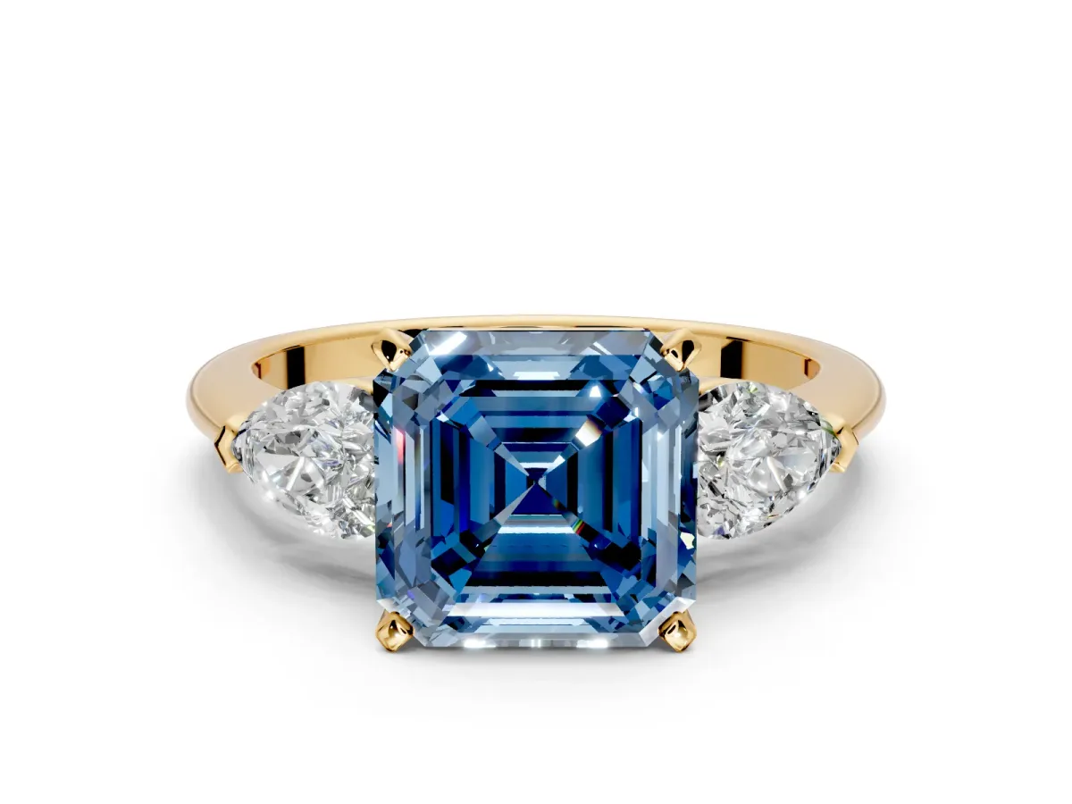 3 Stone Engagement Ring Setting for Fancy Blue Asscher Cut Center with Large Pear-Shaped Accents and Prong Head in Yellow Gold