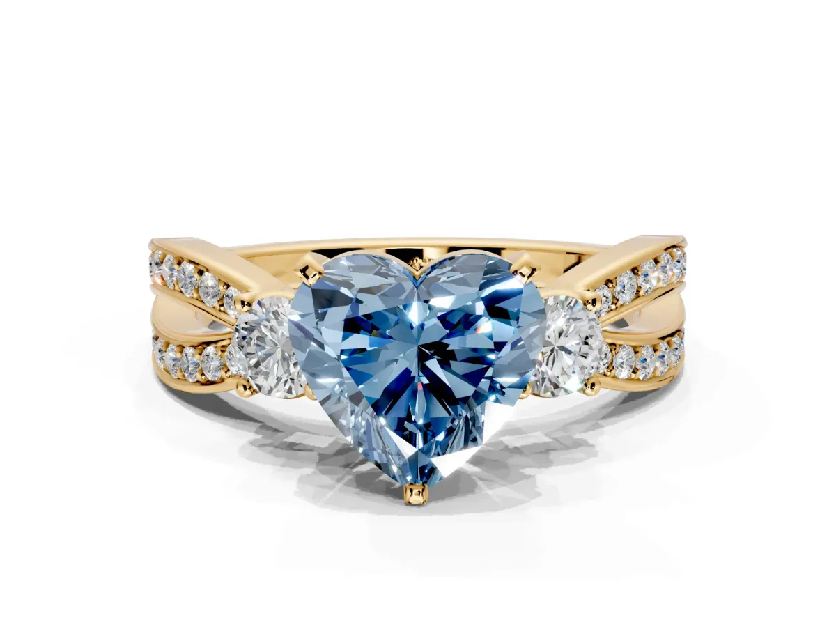 3 Stone Engagement Ring Setting for Fancy Blue Heart-Shaped Center with Pave Twist Band and Prong Head in Yellow Gold
